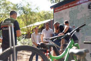 A group of people about to set out on a bike ride from The Hairy Marron